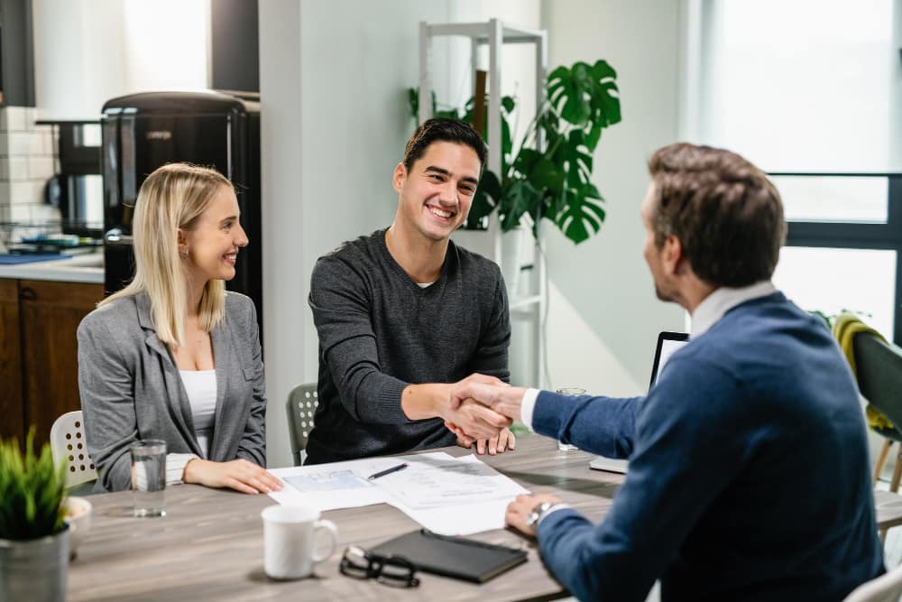 People in a bank shaking hands