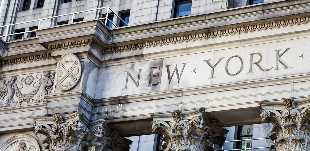 a stone building with a sign on it