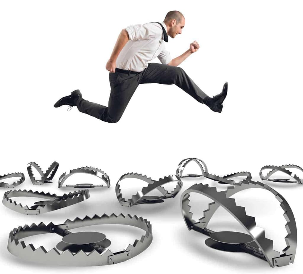 a man jumping over a trap